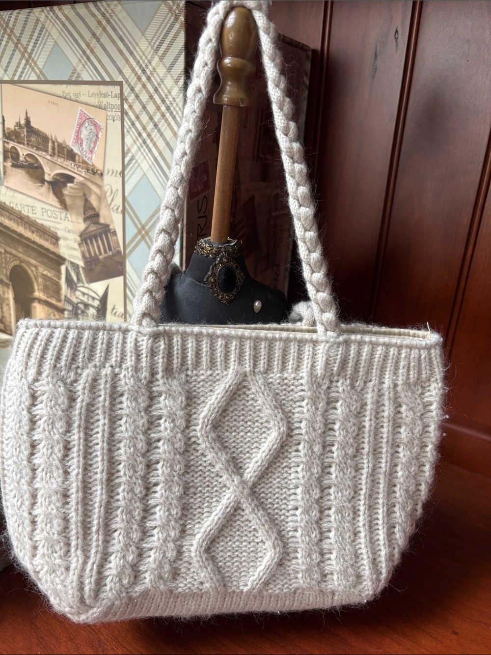cream-colored cable-knit tote bag